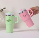 Personalised 14oz kids tumblers in blue and pink with straws